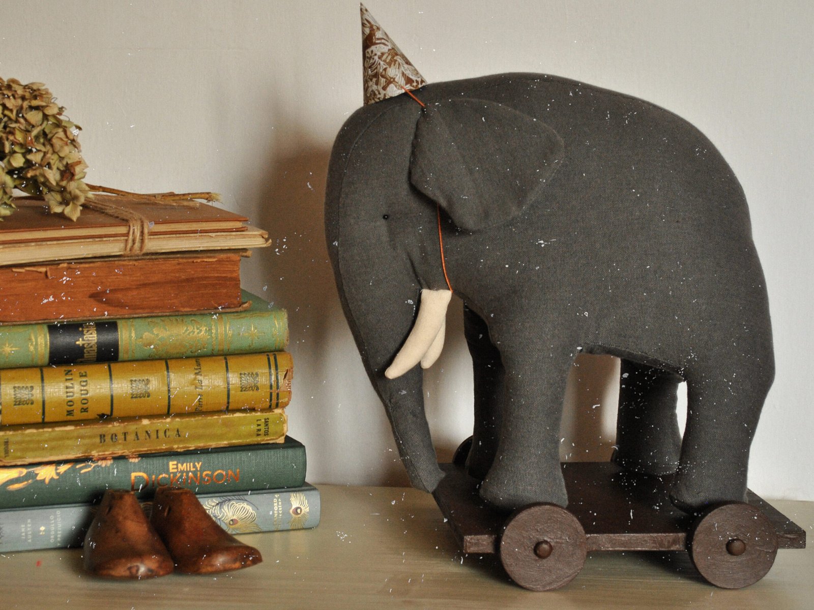 Handmade fabric elephant toy Boran photographed in natural light in art studio